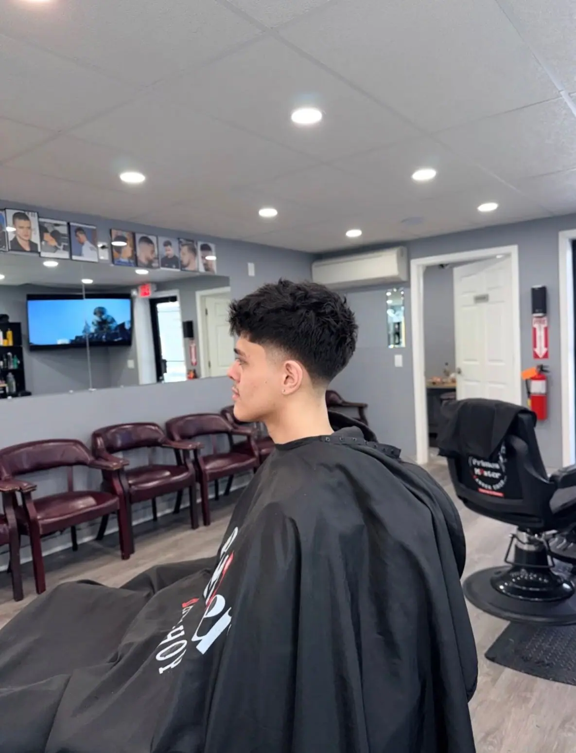 Textured fringe with a low taper fade in the shop